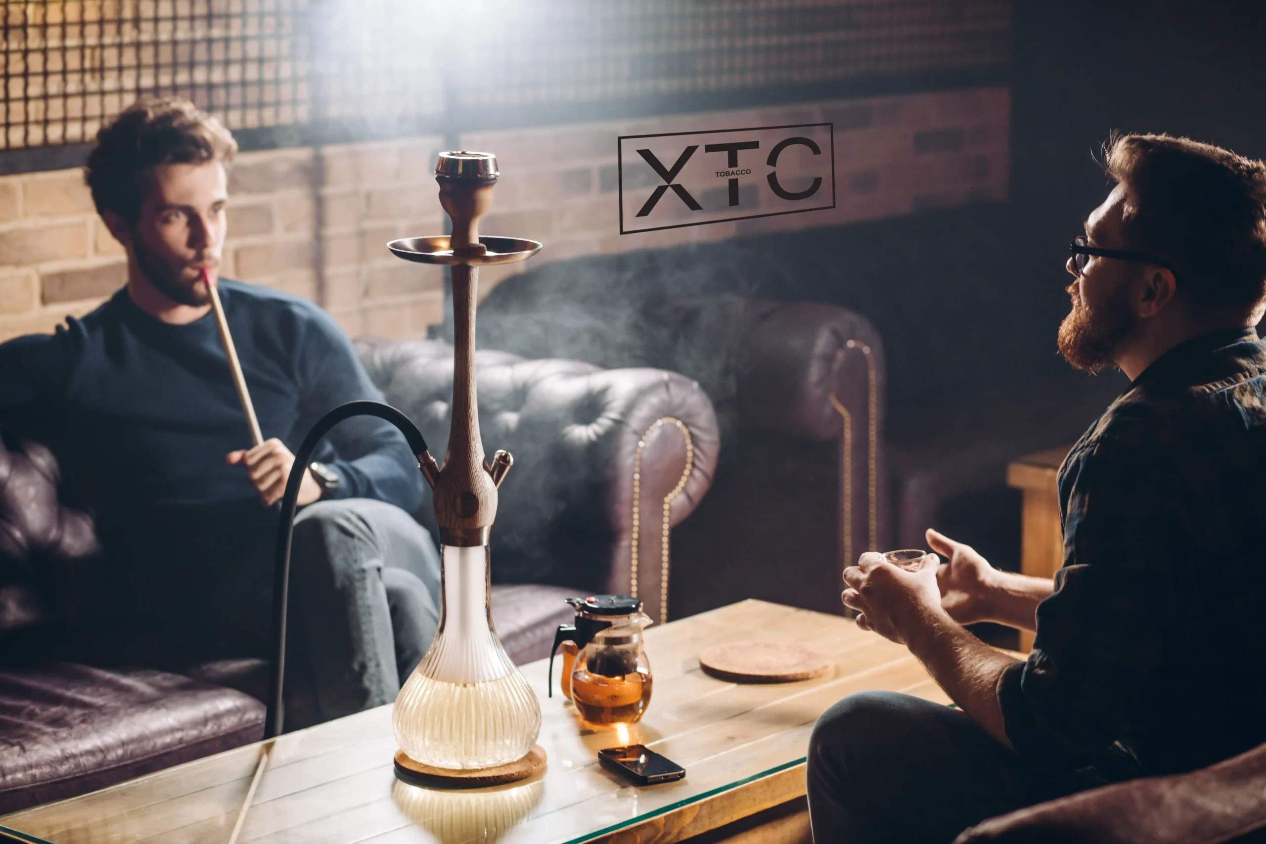 men smoking luxury XTC Tobacco hookah