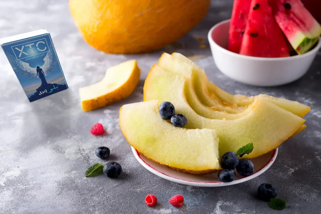 xtc tobacco's blue angel flavor next to its flavor fruits: melon, watermelon and berries