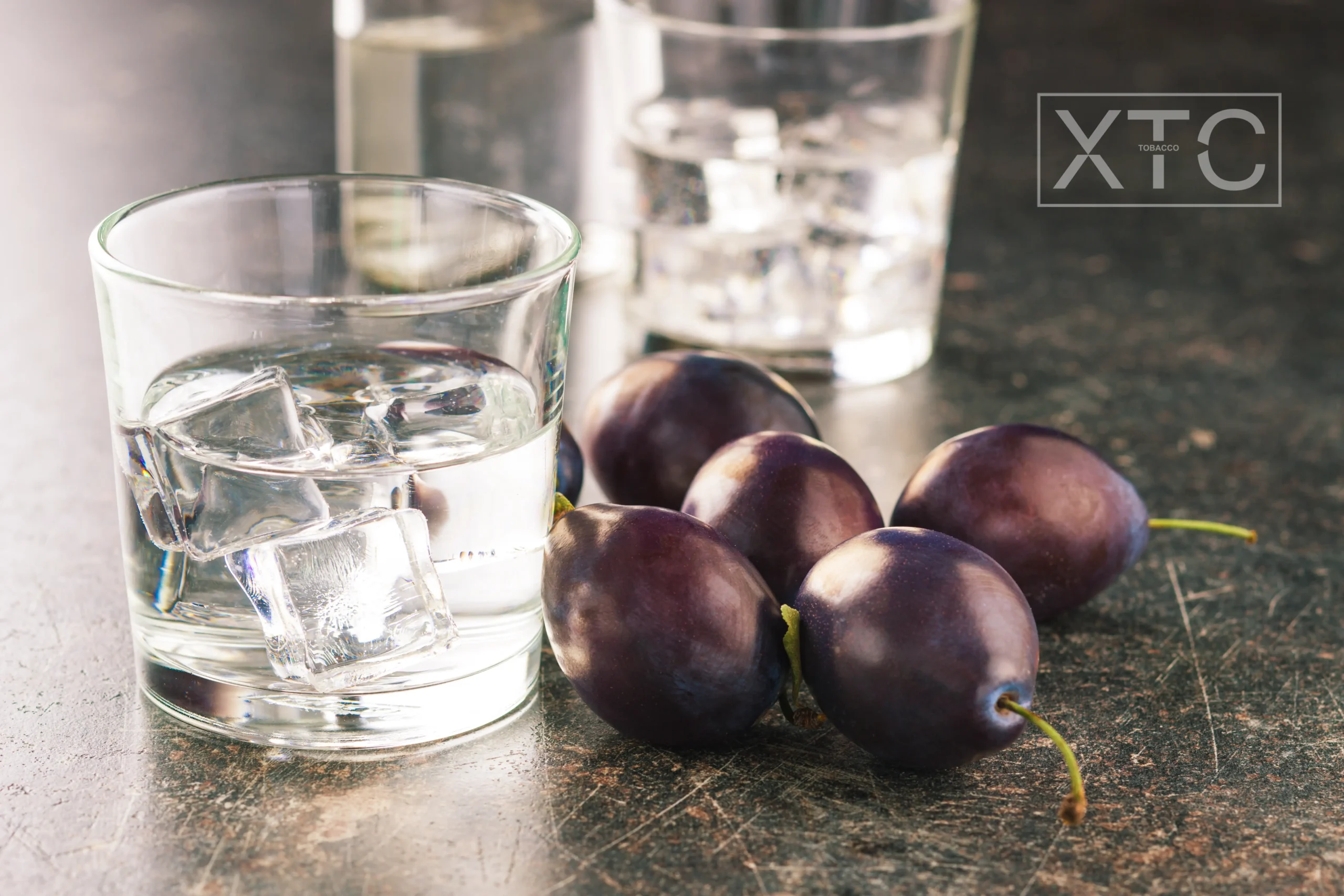 XTC Tobacco plum and Ice hookah tobacco flavor ice and plum on a table