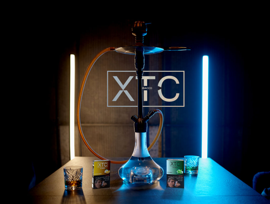 xtc tobacco's orange cream and ice mint flavors next to a hookah